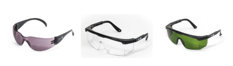 Close-up of wrap-around safety spectacles designed for mining. The glasses feature clear, anti-fog polycarbonate lenses, a rugged black frame with rubberized temples, and a foam gasket seal around the inner rim to block fine dust. The design is sleek yet heavy-duty